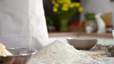 Piece-of-butter-falling-into-flour