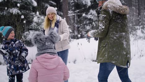 Handheld-video-of-family-having-snowball-fight