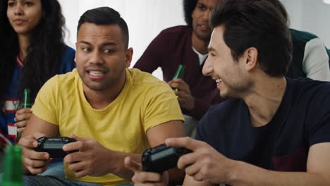 Tracking-video-of--friends-having-fun-while-playing-a-game-console
