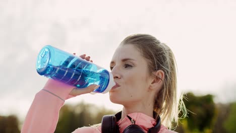 Handheld-view-of-woman-taking-a-sip-of-refreshing-water