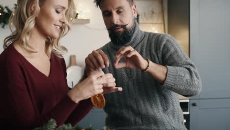 Couple-preparing-Christmas-decorations-together