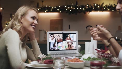 Family-spending-Christmas-Eve-with-friends-by-video-chat