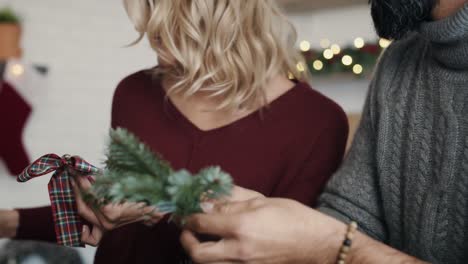 Happy-couple-preparing-decorations-for-Christmas