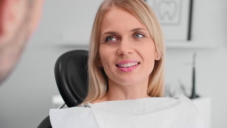 Portrait-of-smiling-woman-at-the-dentist's-office
