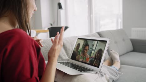 Side-view-of-video-woman-during-video-conference-with-friends
