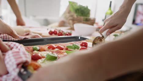 Close-up-video-of-slicing-homemade-pizza-on-the-table