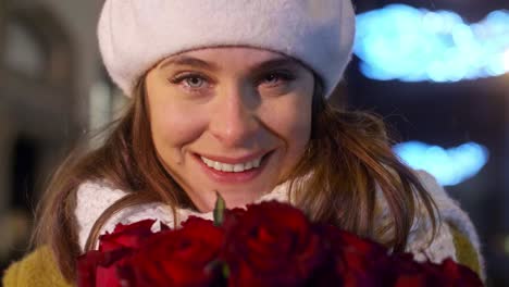 Close-up-of-woman-holding-a-bunch-of-red-roses/Krakow/Poland