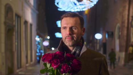 Man-with-a-bunch-of-roses-going-down-the-street