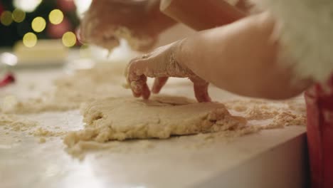 Handheld-view-of-child-rolling-the-dough