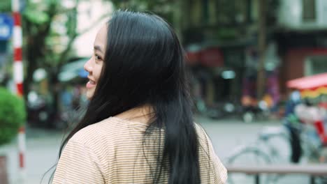Handheld-view-of-beautiful-Vietnamese-woman-in-the-city-street
