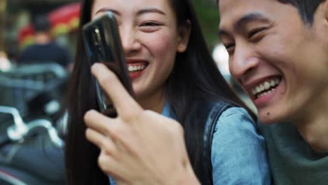 Handheld-view-of-young-couple-making-a-selfie