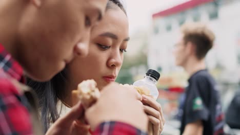 Handheld-view-of-young-couple-enjoying-take-out-food