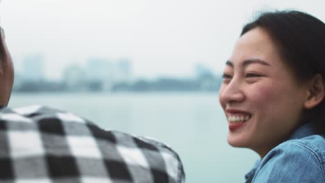 Handheld-view-of-Vietnamese-couple-laughing