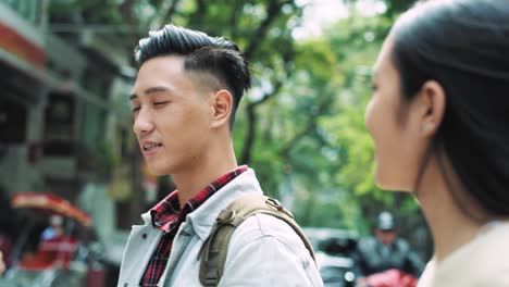 Handheld-video-shows-of-young-couple-walking-in-the-city