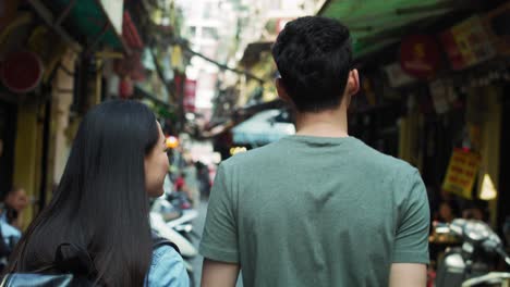 Handheld-view-of-Vietnamese-couple-sightseeing