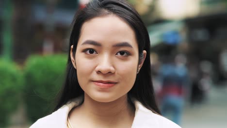 Handheld-video-shows-of-young-Vietnamese-woman-looking-at-camera