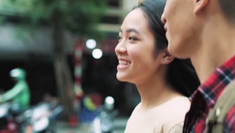 Handheld-view-of-Vietnamese-couple-walking