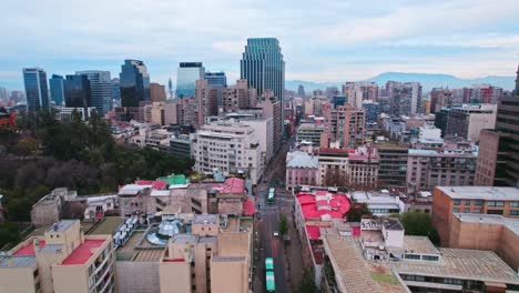 Drone-establishing-shot-of-residential-buildings-in-the-bohemian-neighborhood-of-Lastarria-in-Santiago-Chile,-Santa-Lucia-hill