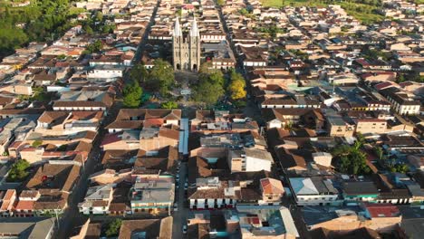 Aerial-View-of-Jardin-Town-in-Colombia,-Basilica-Surrounded-by-Houses-and-Streets
