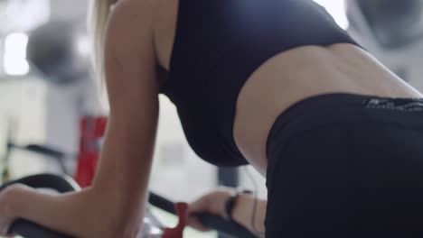 Handheld-view-of-young-woman-working-out-at-the-gym