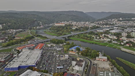 Decin-Czechia-Aerial-v5-panoramic-panning-view-drone-flyover-industrial-area-along-Elbe-river-capturing-views-of-cityscape-and-hillside-landscape-at-daytime---Shot-with-Mavic-3-Cine---November-2022