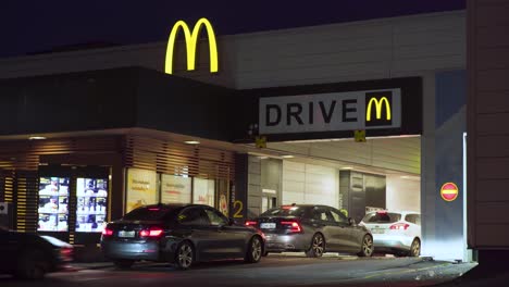 Cars-in-drive-through-at-McDonald's-at-night.-Time-lapse