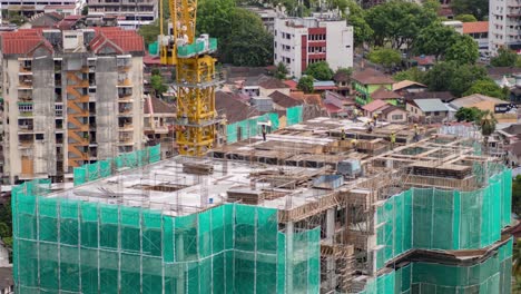 Skilled-Construction-Workers-at-Work:-Time-lapse-of-Building-the-Next-Level-on-a-Rooftop-of-a-Large-Urban-High-rise