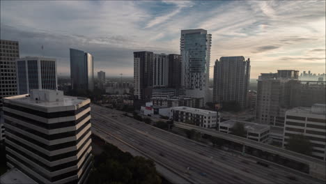 Time-lapse-of-busy-traffic-and-downtown-buildings,-Houston-Texas,-wide-shot