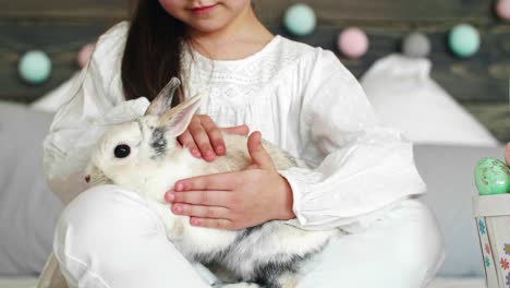 Close-up-of-cute-girl-stroking-the-rabbit