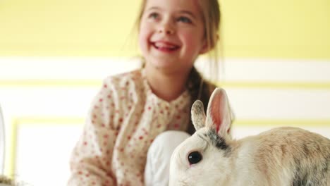 Close-up-of-child-feeding-the-rabbit