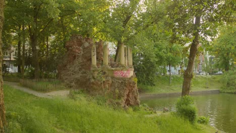 Scenic-view-of-old-ruins-near-the-Ixelles-Pond-in-Brussels,-Belgium