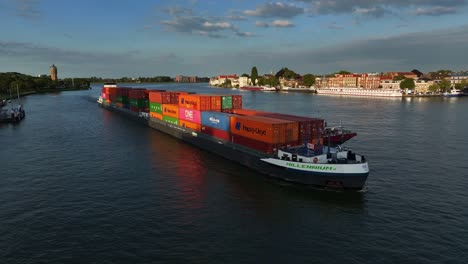 Goods-in-the-supply-chain-sailing-on-the-Oude-Maas-river-at-Dordrecht