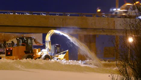 Snow-Blower-Working-To-Clear-Snow-From-Highway-At-Night,-Montreal-Canada