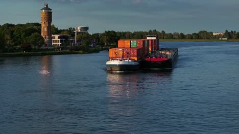 The-container-ship-the-Millenium-sailing-on-the-Oude-Maas-river,-aerial