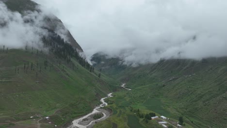 Lush-green-meadows-of-Naran-valley-with-floating-clouds,-Pakistan