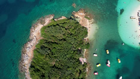 Islands-of-Ksamil:-Crystal-Clear-Turquoise-Waters,-Floating-Boats,-and-Idyllic-Resorts-for-the-Ultimate-Summer-Holiday