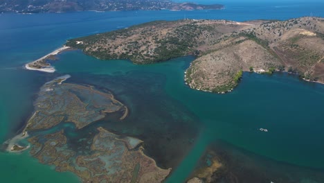 Beautiful-Seaside-of-Ksamil:-Turquoise-Waters,-Shallow-Lagoon,-Reefs,-and-Rocky-Hills-of-Butrint-Await-Your-Visit