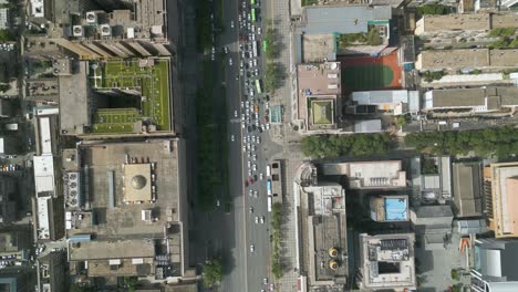 Bird-eye-aerial-drone-view-over-street-traffic-at,-Xian,-large-city-and-capital-of-Shaanxi-Province-in-central-China