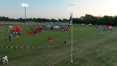 American-flag-waving-at-cross-country-meet-in-USA-at-sunset