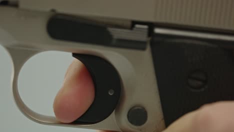Beautiful-macro-of-finger-pulling-trigger-of-pistol