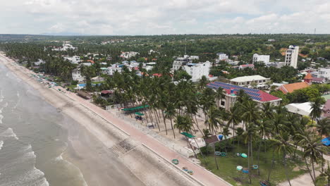 Aerial-drone-footage-of-coastal-promenade-along-the-beach-in-Ham-Tien,-Vietnam