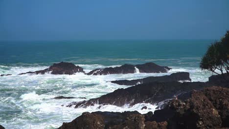 Ocean-waves-hitting-rocky-shore-of-coastline-Indonesia