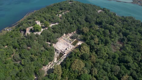 Ancient-Butrint-City-Peninsula:-Stone-Walls-of-the-Castle-and-Amphitheater-Amidst-Serene-Waters,-Exploring-Wonder-of-Europe