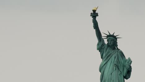 Close-Up-of-Statue-of-Liberty-on-Overcast-Day