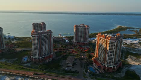 An-aerial-view-of-Portofino-Towers-on-Pensacola-Beach-via-drone,-showing-the-beautiful-scenery-of-this-tropical-paradise