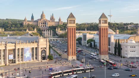 Time-Lapse-of-Plaça-d'Espanya-Roundabout-in-Barcelona,-Elevated-View-Featuring-the-National-Palace,-Busy-Traffic,-Cityscape,-Dusk-to-Dawn