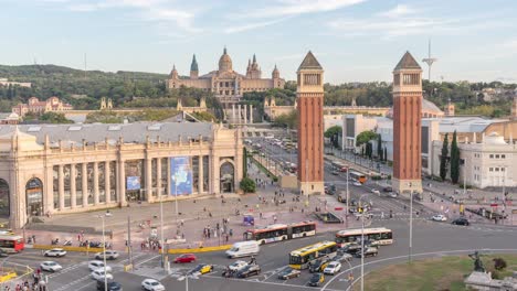 Stunning-Time-lapse-of-Plaça-d'Espanya-Roundabout-in-Barcelona-Featuring-the-Majestic-National-Palace-with-Busy-Traffic,-Spanish-Landmarks,-Cityscape-and-Tourism