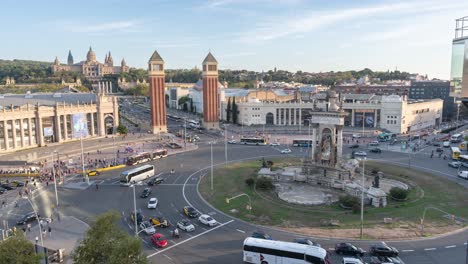 Stunning-Time-lapse-of-Plaça-d'Espanya-Roundabout-in-Barcelona-Featuring-the-Majestic-National-Palace-with-Busy-Traffic,-Spanish-Landmarks,-Cityscape-and-Tourism