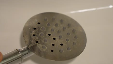 Closeup-view,-dirty-metal-shower-head-with-sediment-of-limescale