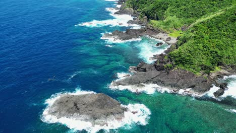 Turquoise-Ocean-Water-And-Rugged-Coastline-In-Baras,-Catanduanes,-Philippines---aerial-drone-shot